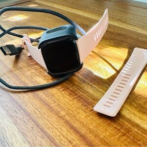 Brand new women’s pink Fitbit Versa
